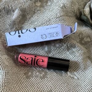 Saie Vibrant Pink Lip Gloss in burst